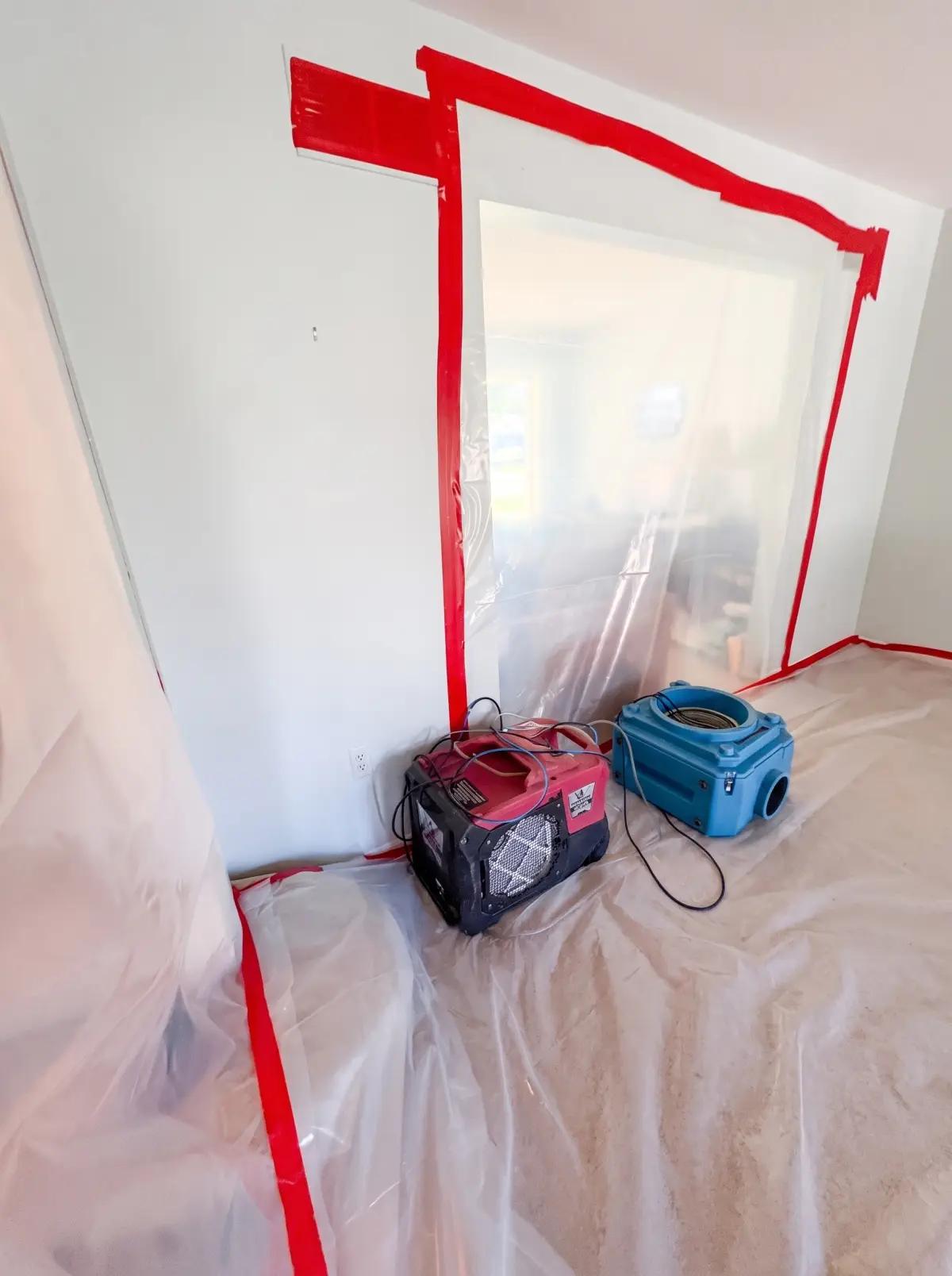 Plastic containment with a dehumidifier and a HEPA air scrubber inside